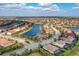 An aerial view of a beautiful community with lakefront properties and lush landscaping at 5511 Foxfire Run, Lakewood Ranch, FL 34211