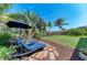 Inviting backyard with patio set and lounge chairs offering a relaxing outdoor space at 5511 Foxfire Run, Lakewood Ranch, FL 34211