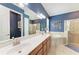 Primary bathroom with double sinks, soaking tub, and a glass-enclosed shower at 5511 Foxfire Run, Lakewood Ranch, FL 34211