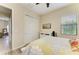 Bright bedroom featuring a comfortable bed, closet, and a window providing natural light at 5511 Foxfire Run, Lakewood Ranch, FL 34211