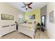 Colorful bedroom with a full bed, bright yellow wall, and fun decor at 5511 Foxfire Run, Lakewood Ranch, FL 34211