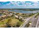 Scenic view of the community showcasing beautiful lakes, walking paths, and meticulously landscaped common areas on a sunny day at 5511 Foxfire Run, Lakewood Ranch, FL 34211