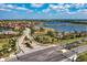 Beautiful street view of the community entrance, featuring lush landscaping, a lake, and meticulously maintained common areas at 5511 Foxfire Run, Lakewood Ranch, FL 34211