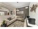 Stylish living room featuring neutral color palette, comfortable seating, and modern decor at 5511 Foxfire Run, Lakewood Ranch, FL 34211