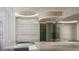 Luxurious bath area featuring modern fixtures, a circular tub and decorative lighting at 555 Quay Cmn # 401, Sarasota, FL 34236