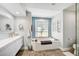 Elegant bathroom with a soaking tub, modern fixtures, and lots of counter space at 5565 Sweetwater Oak Dr, Sarasota, FL 34232