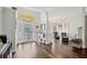 Inviting foyer with decorative glass front door, hardwood floors, and an archway leading to a cozy living area at 5565 Sweetwater Oak Dr, Sarasota, FL 34232
