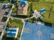Overhead view featuring the playground, dog park, and basketball court, all set amidst green spaces at 6239 Baywood Ct, Bradenton, FL 34211