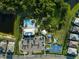 Aerial view showcasing community amenities including pool, clubhouse, playground, basketball court, and parking at 6239 Baywood Ct, Bradenton, FL 34211