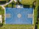 Top-down view of community blue basketball court with white lines and well-maintained landscaping at 6239 Baywood Ct, Bradenton, FL 34211