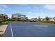 Community basketball court surrounded by lush landscaping offers a recreational amenity for residents at 6239 Baywood Ct, Bradenton, FL 34211