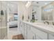 Bright bathroom with double vanity, quartz countertops, and walk-in shower at 6239 Baywood Ct, Bradenton, FL 34211
