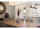 Open-concept dining room with modern finishes and a view into the bright kitchen at 6239 Baywood Ct, Bradenton, FL 34211