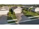 Well maintained front yard featuring manicured landscaping, ample green spaces and a paved driveway at 6239 Baywood Ct, Bradenton, FL 34211