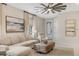 Comfortable seating arrangement with neutral tones, modern furnishings, and inviting atmosphere at 6239 Baywood Ct, Bradenton, FL 34211
