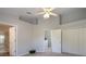 Bedroom featuring soft carpet, access to a bathroom, and closet at 656 Vallance Ne Way, St Petersburg, FL 33716