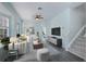 Bright living room features modern furnishings, hardwood flooring, and plenty of natural light at 656 Vallance Ne Way, St Petersburg, FL 33716
