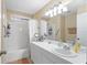 Clean bathroom featuring a sink with white cabinets and a shower/tub combo at 712 68Th W Ave, Bradenton, FL 34207