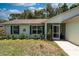 Charming single-story home with a screened-in porch and well-maintained landscaping at 712 68Th W Ave, Bradenton, FL 34207