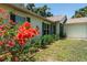 Attractive home featuring vibrant bougainvillea and manicured landscaping at 712 68Th W Ave, Bradenton, FL 34207