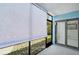 Balcony with white blinds and a view to the outside yard at 7211 Cloister Dr # 101, Sarasota, FL 34231