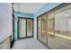 Balcony with a view to the outside and doors to the inside of the house at 7211 Cloister Dr # 101, Sarasota, FL 34231