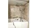 Modern bathroom featuring a walk-in tub with a luxurious shower head and safety bars at 7211 Cloister Dr # 101, Sarasota, FL 34231