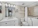 Bathroom with tub and shower, vanity and mirror at 7211 Cloister Dr # 101, Sarasota, FL 34231