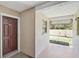 Inviting front porch with a covered area, perfect for enjoying the outdoors at 7211 Cloister Dr # 101, Sarasota, FL 34231