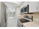 Modern kitchen with stainless appliances and granite countertops at 7211 Cloister Dr # 101, Sarasota, FL 34231