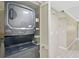 Laundry area featuring a stacked washer and dryer, closet, and plank floors at 7211 Cloister Dr # 101, Sarasota, FL 34231