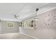 Bright living space featuring laminate flooring, a ceiling fan, and stylish lighting at 7211 Cloister Dr # 101, Sarasota, FL 34231