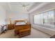 Bright bedroom with a king bed, and a window bench perfect for reading at 7432 Birds Eye Ter, Bradenton, FL 34203
