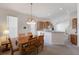 Traditional dining room features a wooden table, chairs, and decorative chandelier at 7432 Birds Eye Ter, Bradenton, FL 34203
