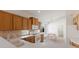 Spacious kitchen with bright lighting, tile floors and modern appliances at 7432 Birds Eye Ter, Bradenton, FL 34203