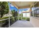 Screened patio with views of the landscaped backyard and surrounding greenery at 7432 Birds Eye Ter, Bradenton, FL 34203