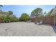 Large backyard patio area with tropical plants and lounge chairs at 815 N East Ave, Sarasota, FL 34237