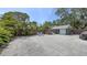 Spacious backyard featuring a large paved area, perfect for outdoor entertaining and relaxation at 815 N East Ave, Sarasota, FL 34237