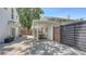 Charming backyard patio with a covered dining area, modern fencing, and seamless transition to the home at 815 N East Ave, Sarasota, FL 34237