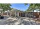 Backyard patio with a covered dining area, accessible through a modern gate, perfect for outdoor living at 815 N East Ave, Sarasota, FL 34237