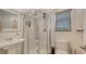 Modern bathroom features a glass-enclosed shower and sleek fixtures at 815 N East Ave, Sarasota, FL 34237