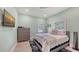 Bedroom with wood floors, ceiling fan, blue blanket on bed, and windows at 815 N East Ave, Sarasota, FL 34237