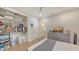 Bedroom with wood floors, ceiling fan, closet, and gray dresser at 815 N East Ave, Sarasota, FL 34237