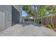 Paved driveway leading to a garage with landscaping and trees adding to the curb appeal at 815 N East Ave, Sarasota, FL 34237