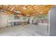 Spacious garage featuring exposed ceiling, shelving, workspace, and ample storage and parking at 815 N East Ave, Sarasota, FL 34237