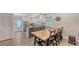 Bright kitchen featuring white cabinets, modern appliances, and a spacious dining area for Gathering meals and gatherings at 815 N East Ave, Sarasota, FL 34237