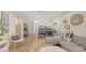 Open-concept living room featuring stylish decor, a comfortable sectional, and views of the adjacent kitchen and dining area at 815 N East Ave, Sarasota, FL 34237