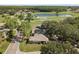 The aerial view captures the home's prime location near a tranquil lake and green spaces at 1111 Harefield Cir, Sun City Center, FL 33573