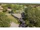 Aerial view shows the home's location near lush green spaces, highlighting a serene community at 1111 Harefield Cir, Sun City Center, FL 33573