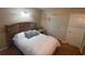 Simple bedroom featuring a comfortable bed and closet space at 1111 Harefield Cir, Sun City Center, FL 33573